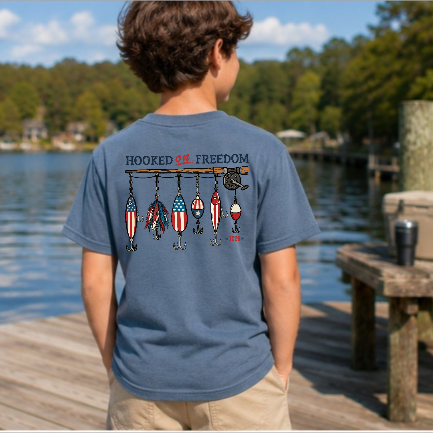 Hooked on Freedom youth tee in Indigo Blue with patriotic fishing lure graphic