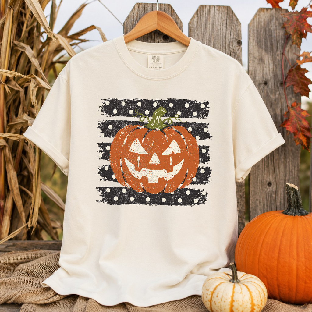 Polka dot pumpkin jack-o-lantern graphic tee on Comfort Colors 1717 Ivory